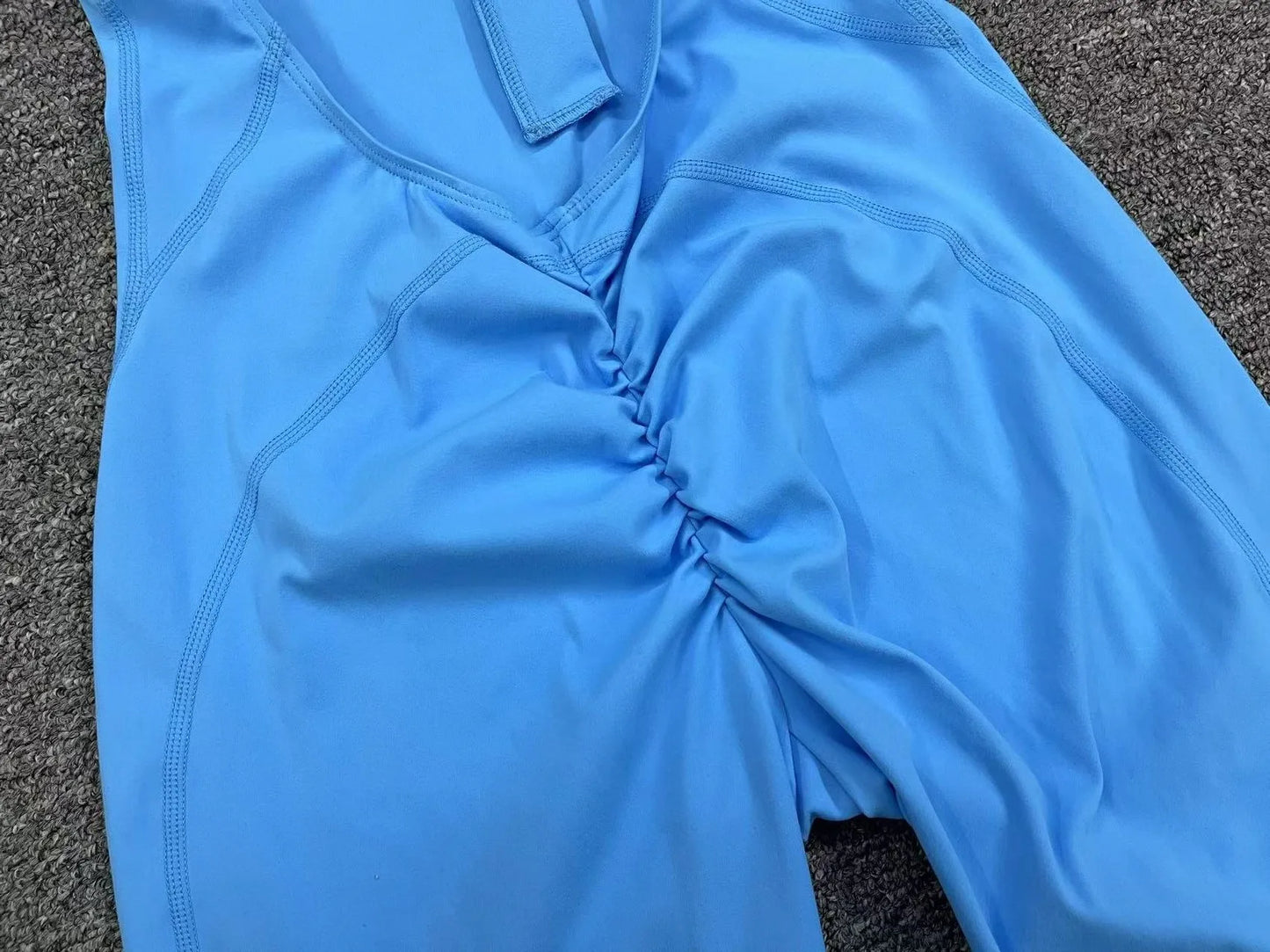 Mono deportivo corto sin mangas para mujer